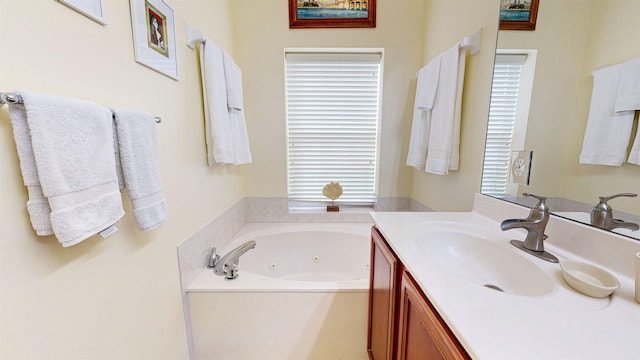 bathroom with vanity and a washtub