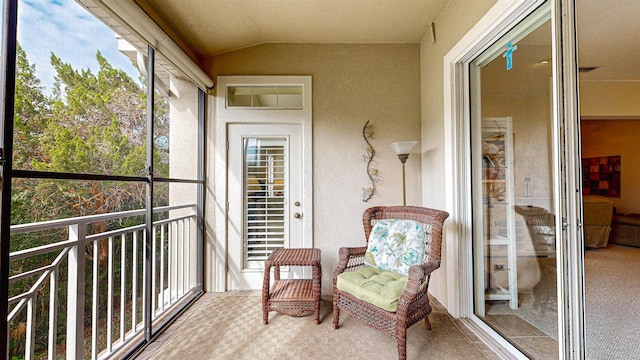 sunroom / solarium with lofted ceiling