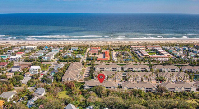 bird's eye view featuring a view of the beach and a water view