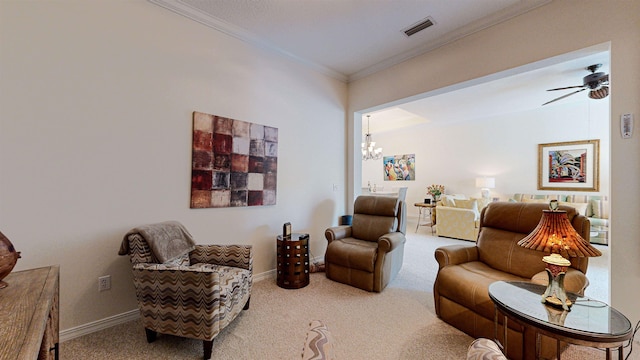 living room featuring ceiling fan with notable chandelier, carpet flooring, and ornamental molding