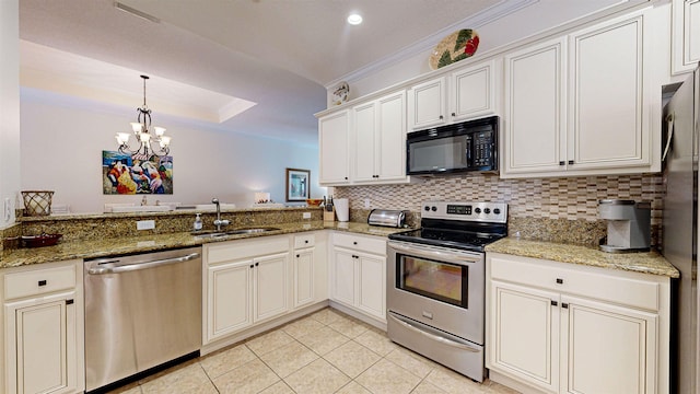 kitchen with stainless steel appliances, a chandelier, sink, and stone counters