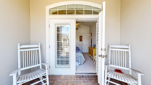 view of exterior entry featuring french doors