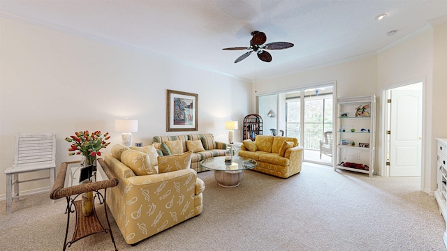 carpeted living room with ceiling fan and crown molding