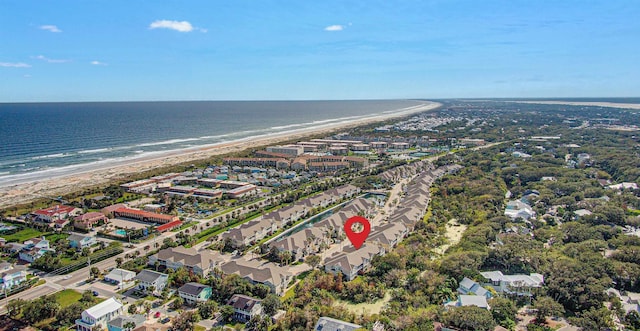 birds eye view of property with a beach view and a water view