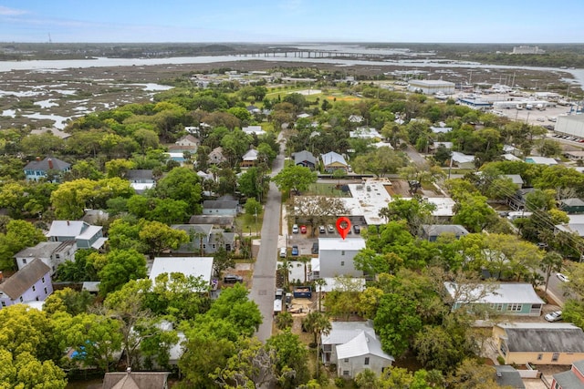 birds eye view of property featuring a water view and a residential view