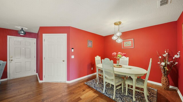 dining area featuring hardwood / wood-style floors