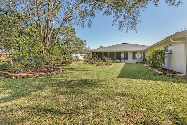 view of yard featuring a sunroom