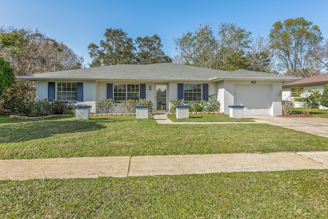 single story home featuring concrete driveway, a front lawn, and an attached garage