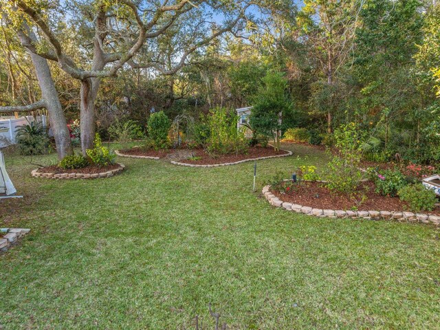 birds eye view of property featuring a wooded view and a residential view