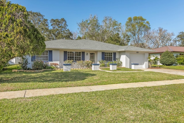 ranch-style home featuring a garage, a front yard, driveway, and a shingled roof