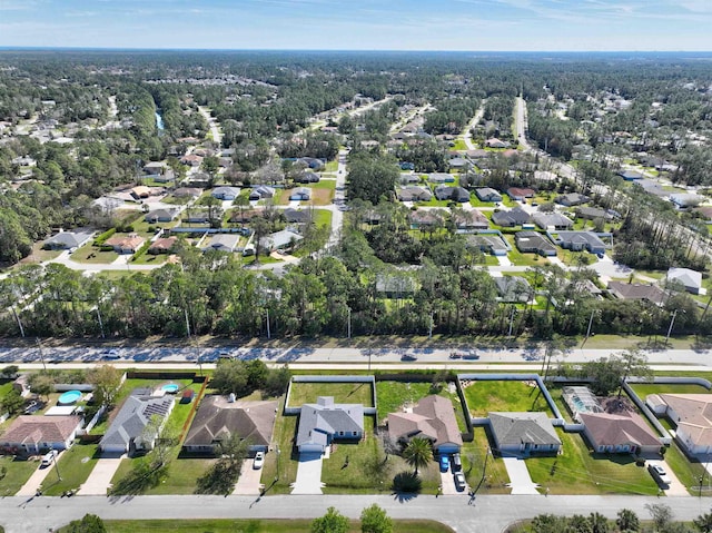 birds eye view of property with a residential view