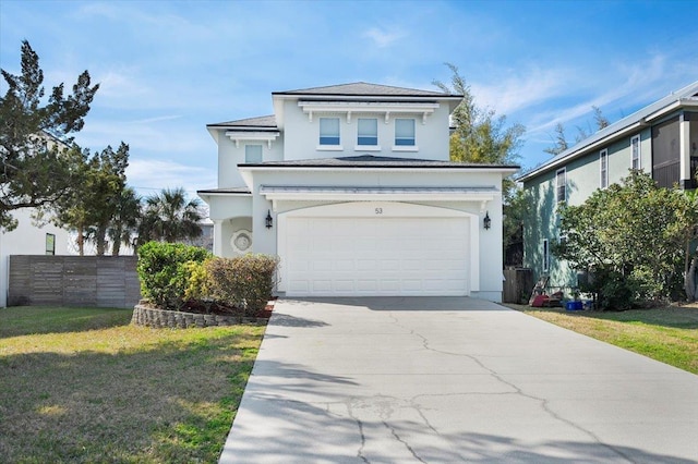 front of property with a garage and a front lawn