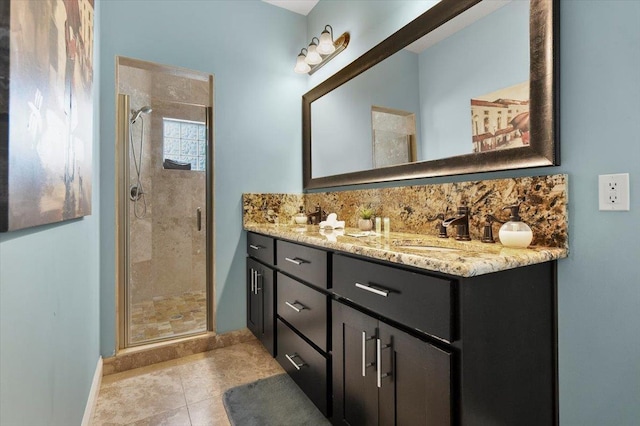 bathroom featuring vanity, an enclosed shower, and tile patterned flooring