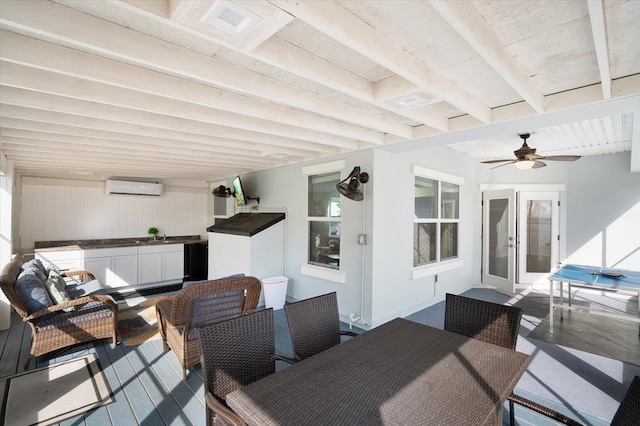 interior space featuring an outdoor living space, an AC wall unit, and ceiling fan