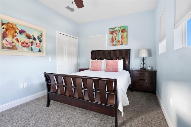 carpeted bedroom with ceiling fan and a closet