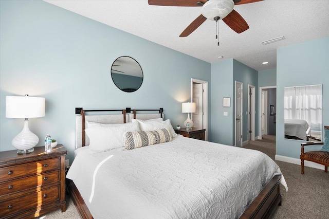 bedroom featuring ceiling fan, carpet, and a textured ceiling