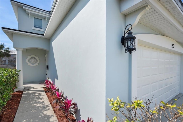 view of exterior entry featuring a garage