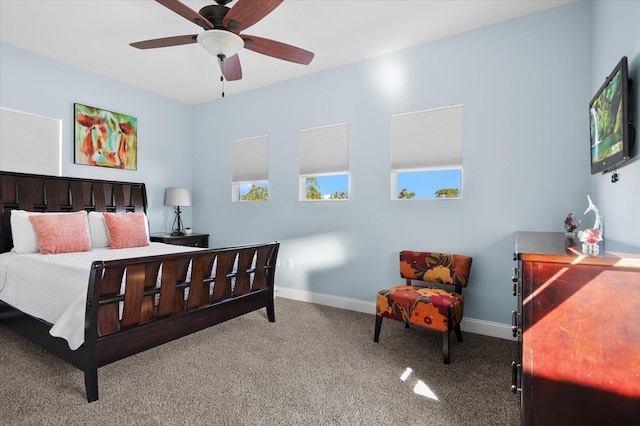 bedroom featuring light colored carpet and ceiling fan