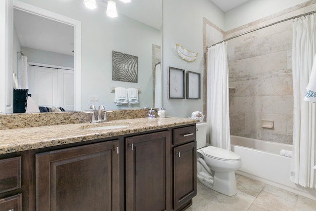 full bathroom featuring vanity, shower / tub combo, and toilet