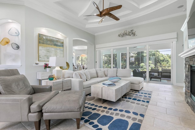 tiled living room featuring coffered ceiling, beam ceiling, a fireplace, and ceiling fan