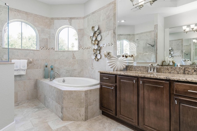 bathroom with vanity, plus walk in shower, and a notable chandelier