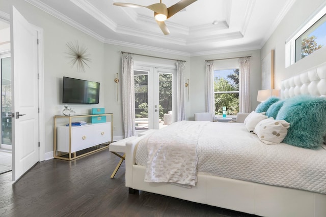 bedroom featuring ceiling fan, access to exterior, a tray ceiling, ornamental molding, and french doors