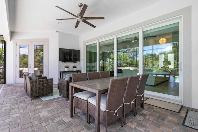 sunroom with ceiling fan and french doors