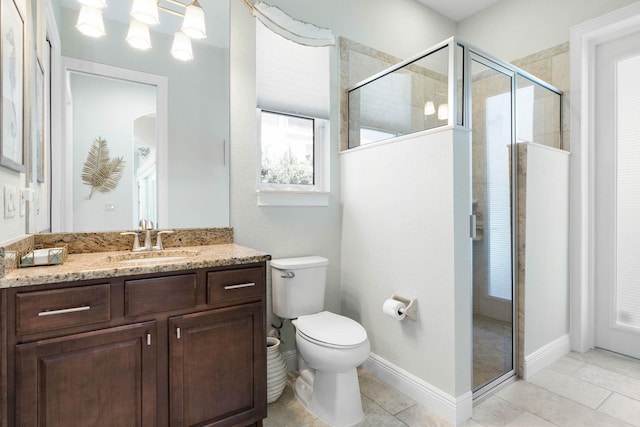 bathroom with vanity, tile patterned floors, toilet, and walk in shower