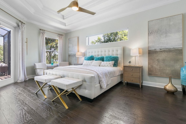 bedroom with ceiling fan, ornamental molding, dark hardwood / wood-style flooring, and a raised ceiling