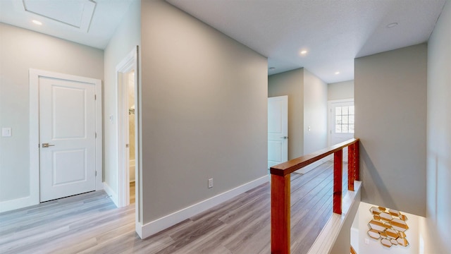 hallway with light hardwood / wood-style flooring