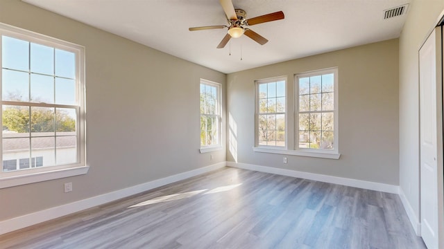 unfurnished room featuring ceiling fan and light hardwood / wood-style floors