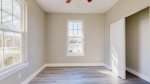 unfurnished room featuring ceiling fan and light wood-type flooring