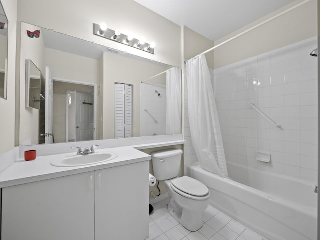 full bathroom featuring tile patterned floors, vanity, toilet, and shower / tub combo