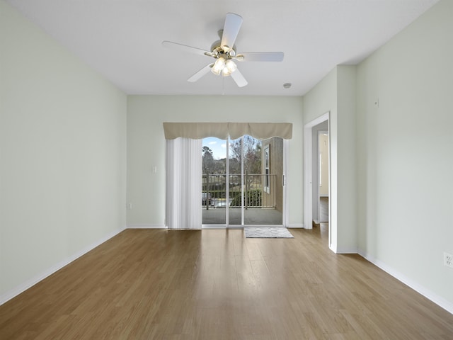 empty room with light hardwood / wood-style flooring and ceiling fan