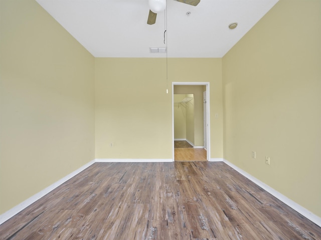 empty room featuring hardwood / wood-style floors and ceiling fan