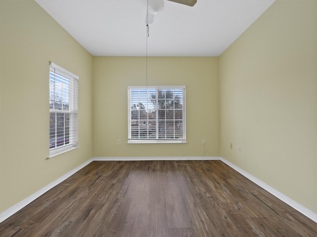 unfurnished dining area with dark hardwood / wood-style flooring and ceiling fan