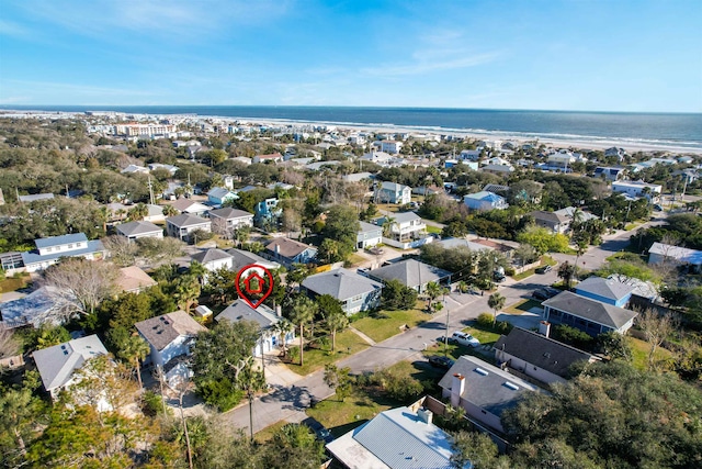 drone / aerial view with a residential view and a water view