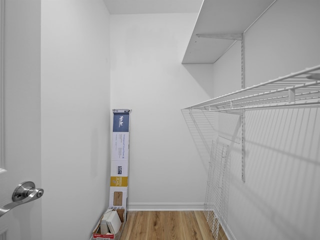 spacious closet with wood finished floors