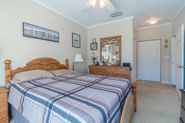 bedroom with ceiling fan, a closet, and crown molding