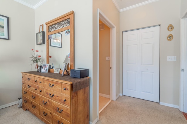 hall with crown molding and light carpet