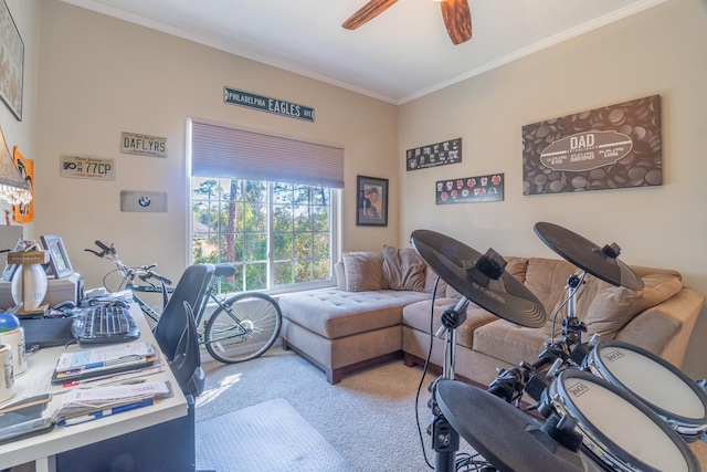 carpeted office space with ceiling fan and crown molding