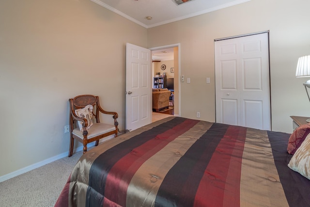 bedroom with crown molding, a closet, and carpet