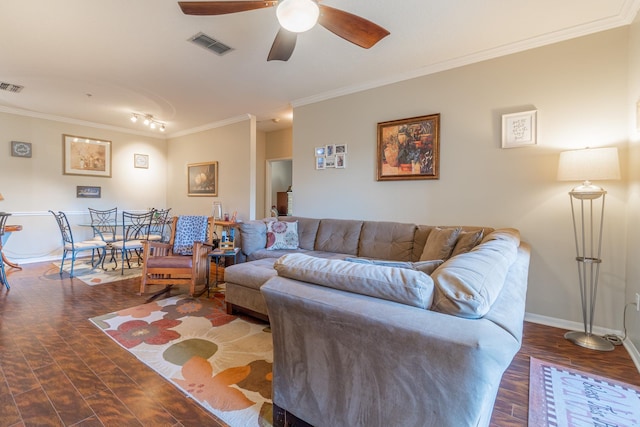 living room featuring dark wood-type flooring, ceiling fan, and ornamental molding