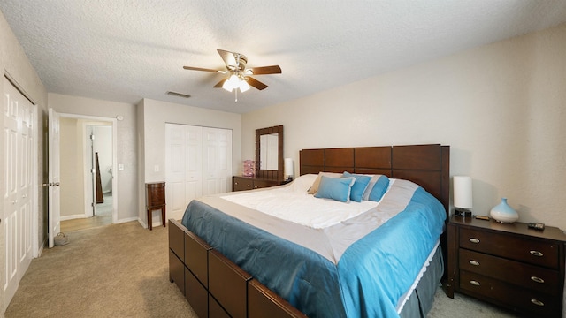11428 Rustic Pines Cir, Jacksonville, FL 32257 - bedroom featuring light carpet, a ceiling fan, and a textured ceiling