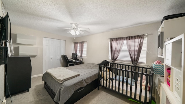 11428 Rustic Pines Cir, Jacksonville, FL 32257 - carpeted bedroom featuring a closet, a textured ceiling, and a ceiling fan