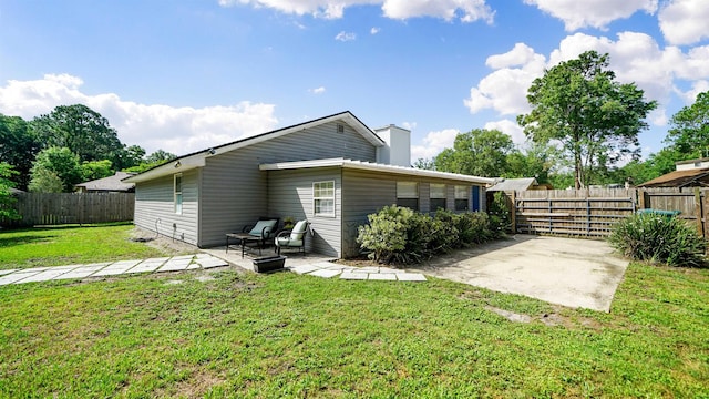 11428 Rustic Pines Cir, Jacksonville, FL 32257 - back of property with a patio and a chimney