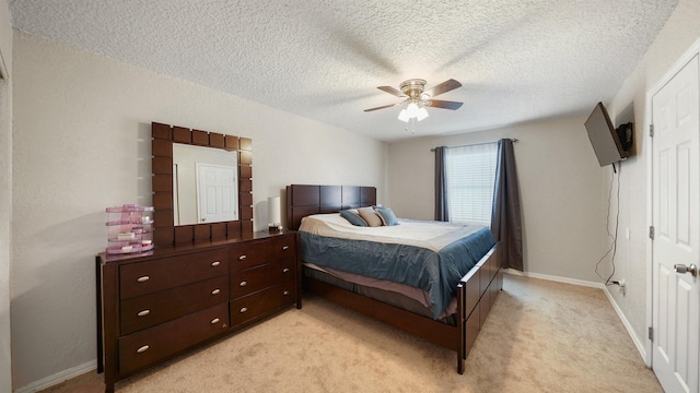 11428 Rustic Pines Cir, Jacksonville, FL 32257 - bedroom with a textured ceiling, light carpet, ceiling fan, and baseboards