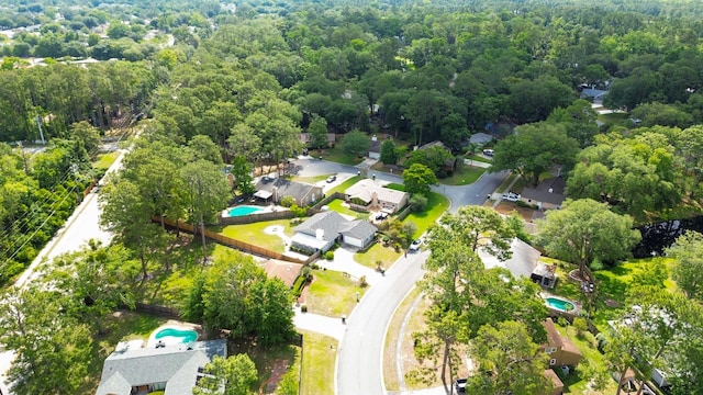 11428 Rustic Pines Cir, Jacksonville, FL 32257 - aerial view of property and surrounding area featuring a pool and a heavily wooded area