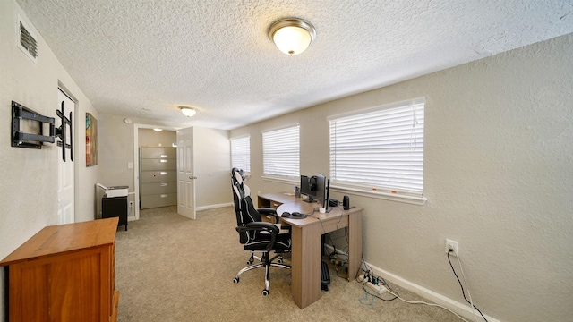 11428 Rustic Pines Cir, Jacksonville, FL 32257 - home office with a textured ceiling, light carpet, and baseboards
