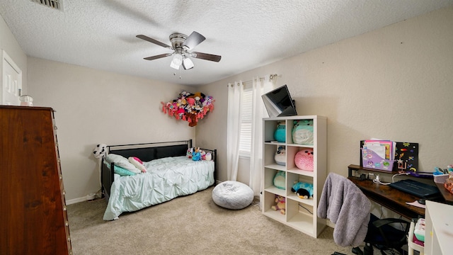 11428 Rustic Pines Cir, Jacksonville, FL 32257 - carpeted bedroom featuring ceiling fan, a textured ceiling, and baseboards